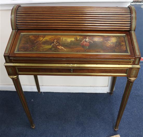 A late 19th century Louis XVI style brass moulded mahogany writing table, W. 68cm